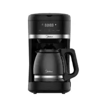 Black Midea drip coffee maker with glass carafe and digital display for brewing coffee.