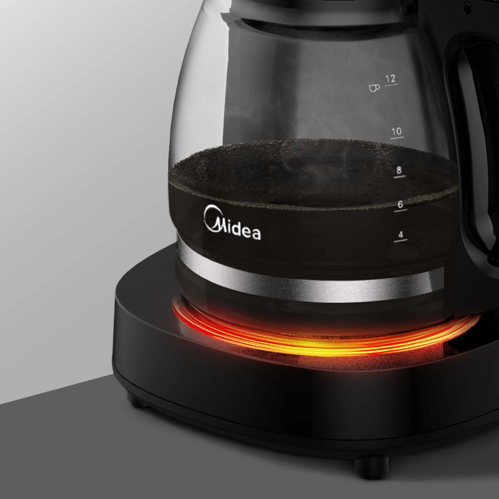 Midea coffee maker carafe on a warming base with a glowing red heating ring and visible water level marks